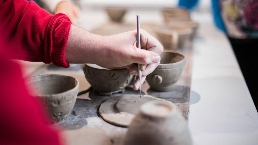 A person making pottery