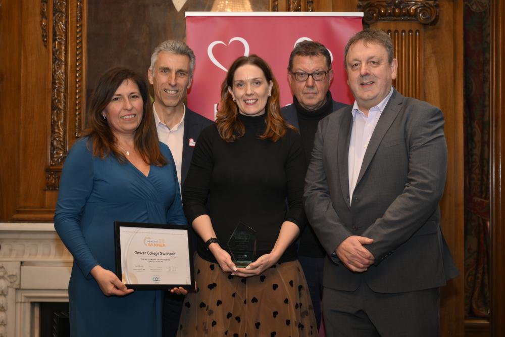 Director of Work-Based Learning Rachel Jones, Learner Support Emma Davies, and Chief Executive Officer Mark Jones are pictured with members of the Association of Colleges and the Beacon Award for Widening Participation. 