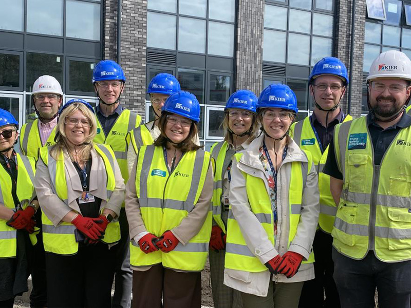 Group photo with senior leaders in hi-vis