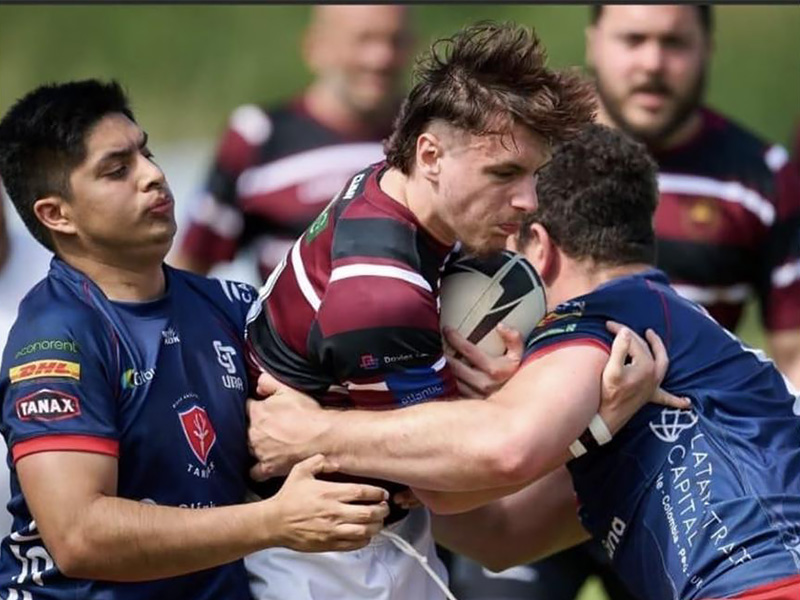 ILS student Tomos Rees getting tackled in Rugby
