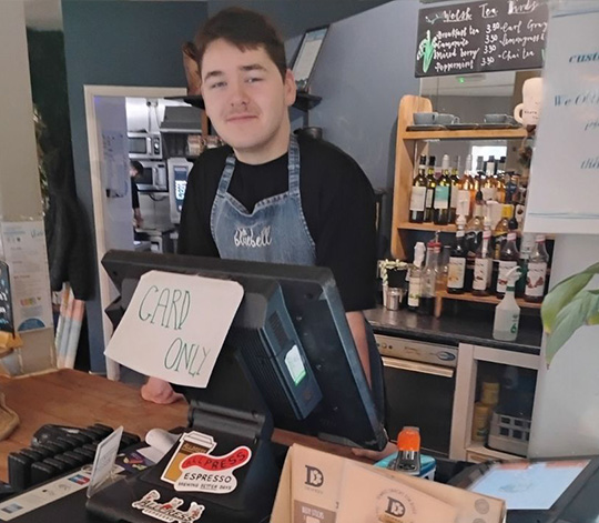 ILS student working in a cafe