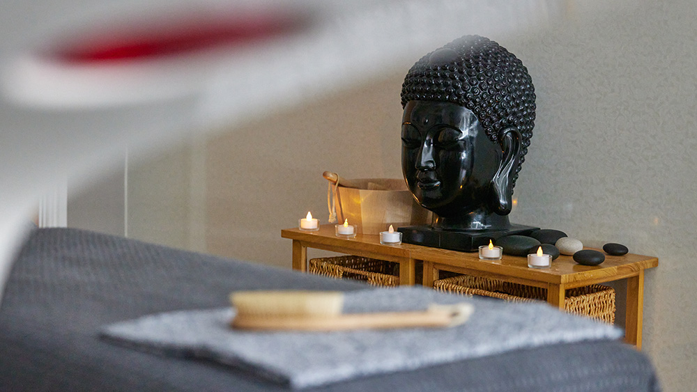 buddha head and massage table in Broadway holistic room