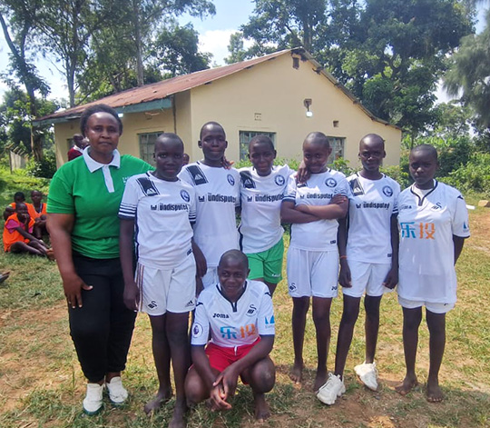 Madungu school pupils wearing Swansea City football kit