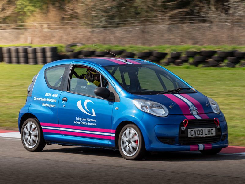 Car on racing track with GCS branding