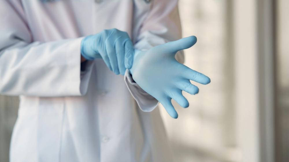 two students in lab coats in a laboratory