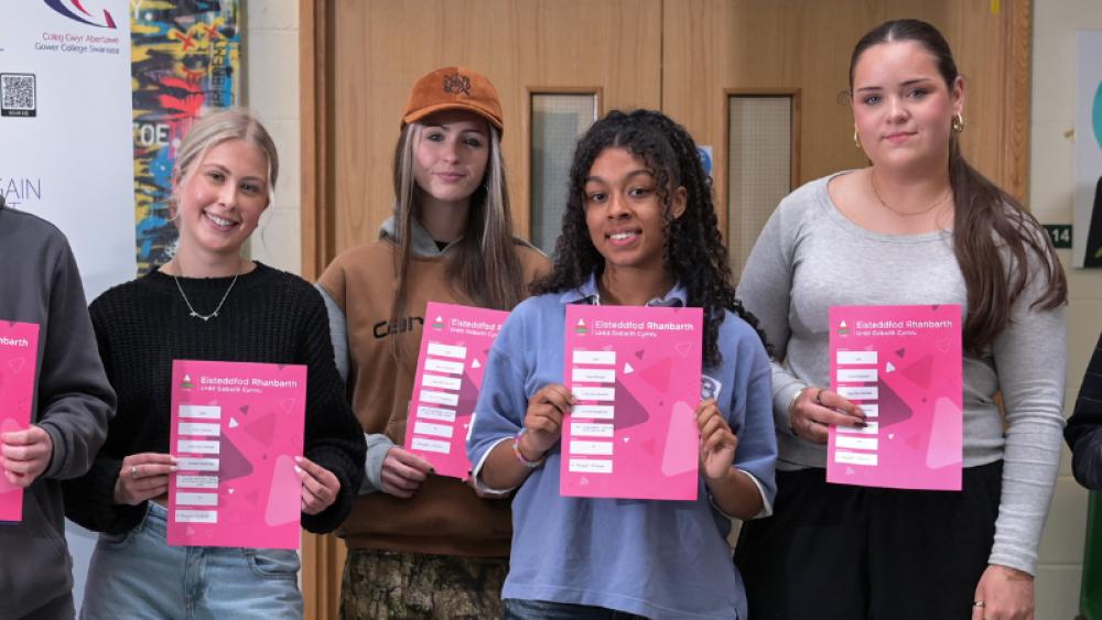Award winning students stand with their certificates 