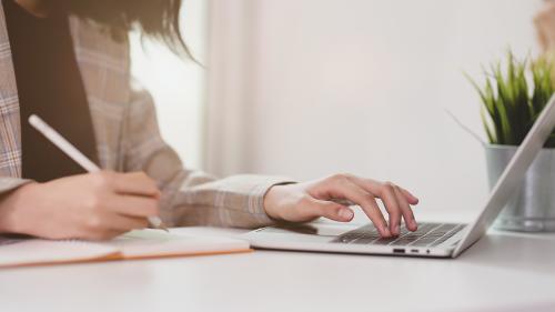 Person typing on a laptop