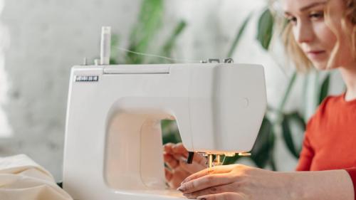 person using a sewing machine