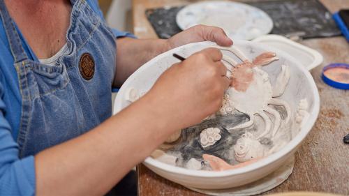 Clay pot being made by a student in a Gower College Swansea class