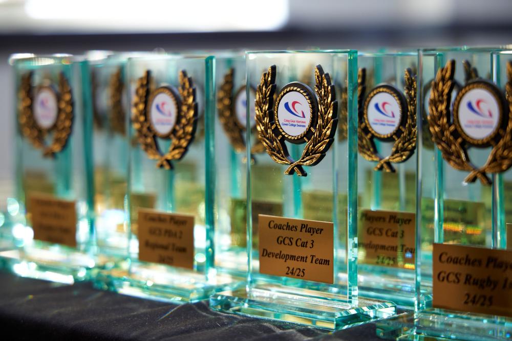 Picture of glass awards with Gower College Swansea Logo 