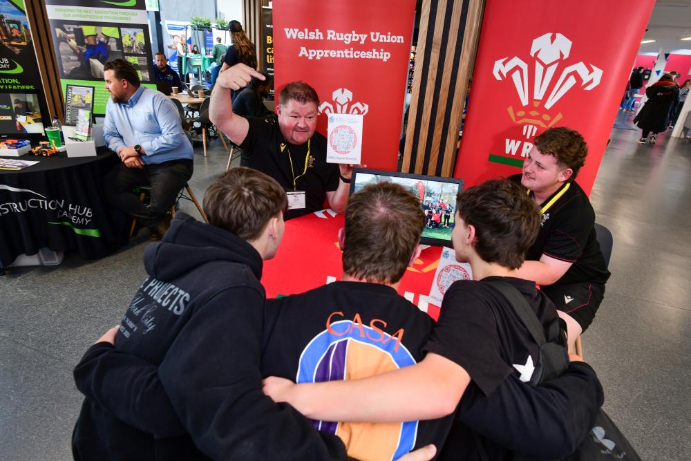 Students scrum up with the WRU at the Gower College Swansea Apprenticeship Fair.