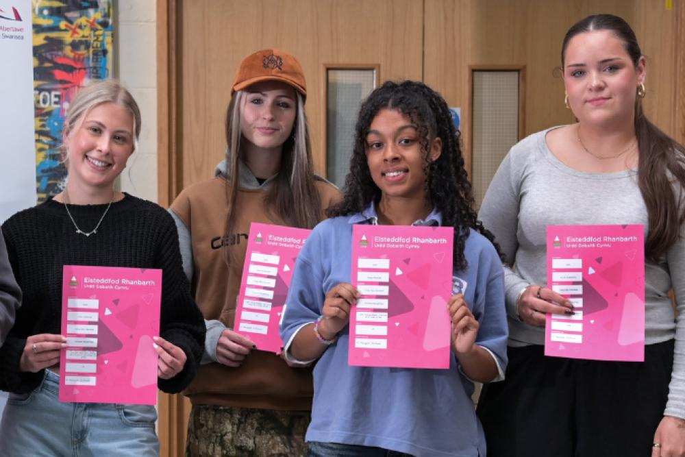 Award winning students stand with their certificates 