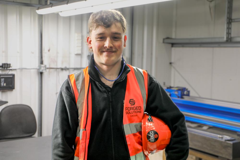 Degree apprentice Lewys Brill pictured in his workplace.
