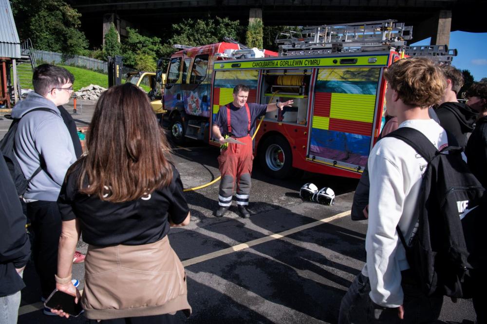 Firefighters talking to students